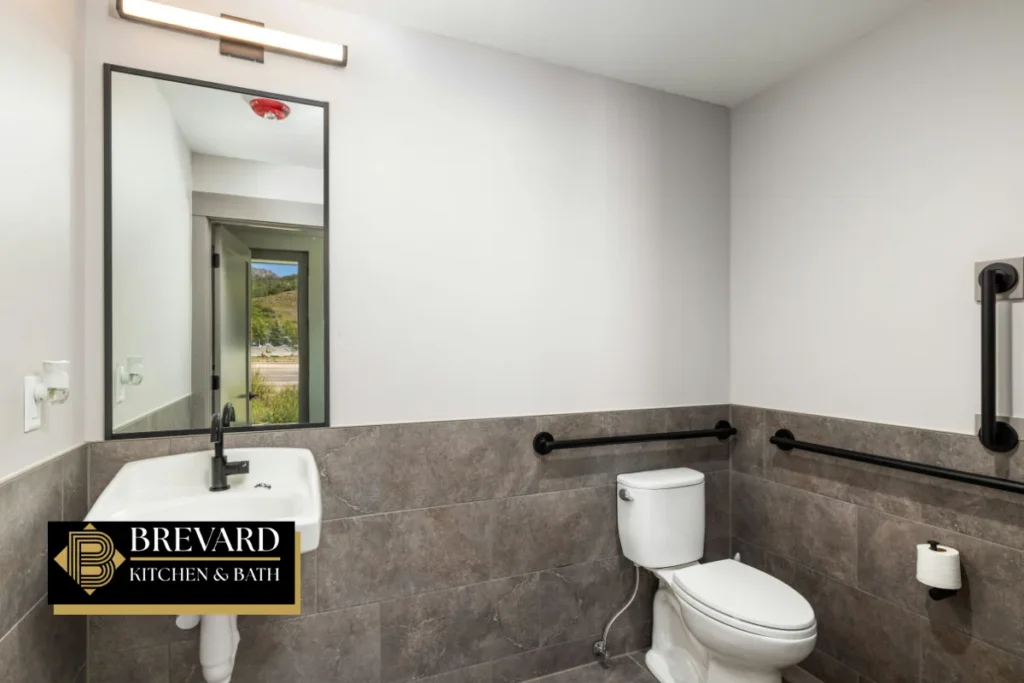 Accessible bathroom with grab bars and a raised toilet