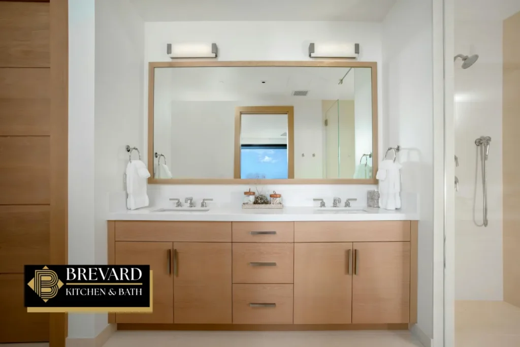 Wood double vanity with a wide mirror next to the shower
