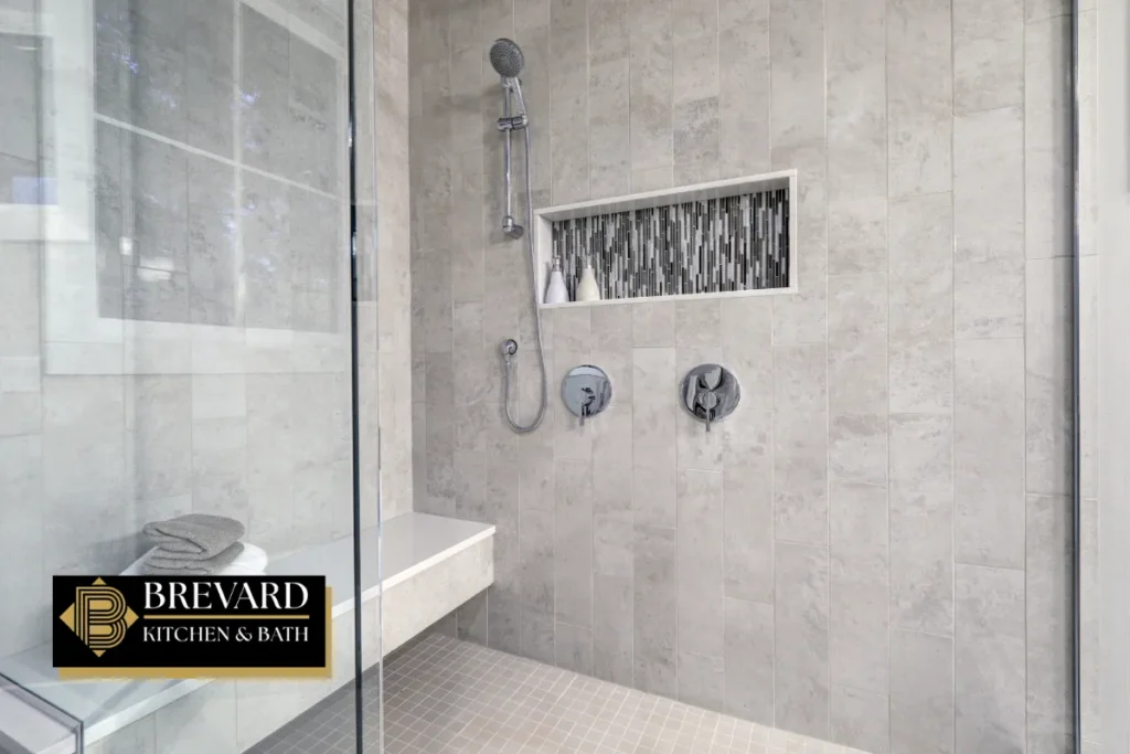 Walk-in tiled shower with a built-in niche after a tub conversion