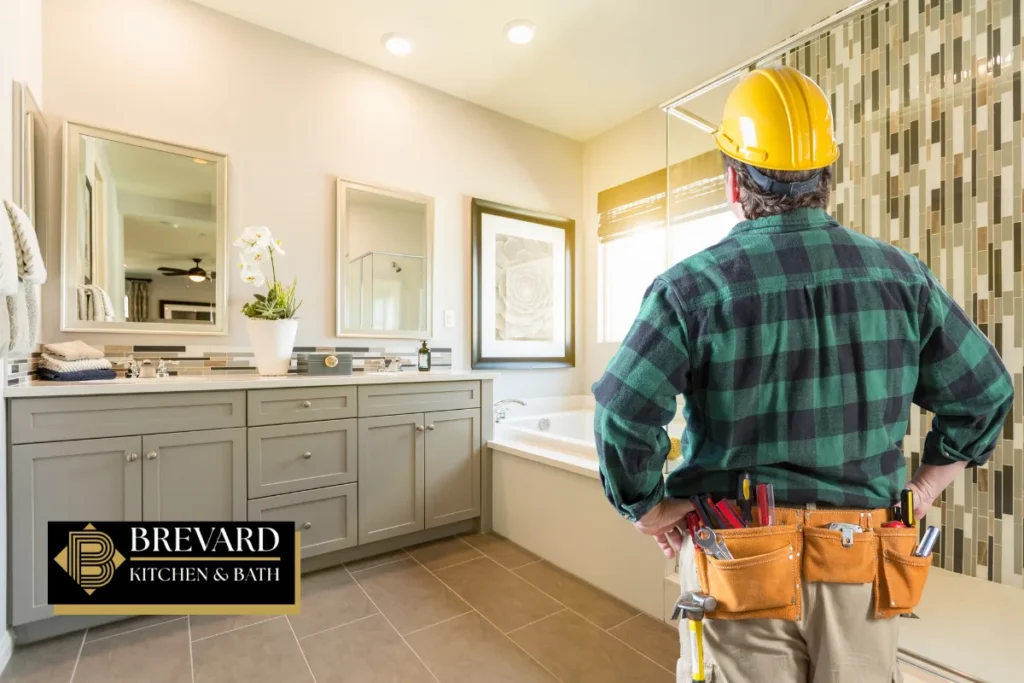 Contractor in a hard hat reviewing a bathroom remodel
