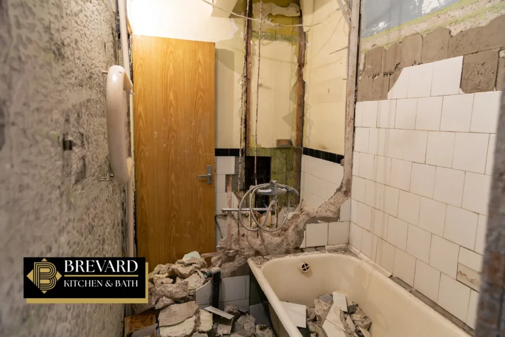 Old bathroom torn out before a curbless shower remodel