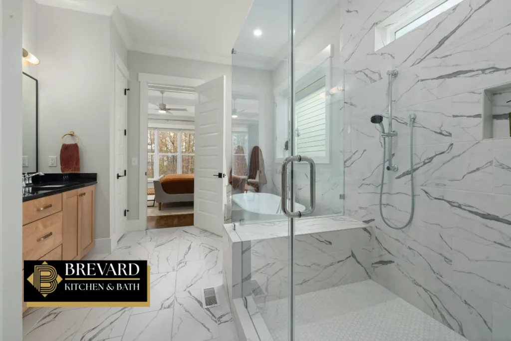 Curbless marble shower with a glass door