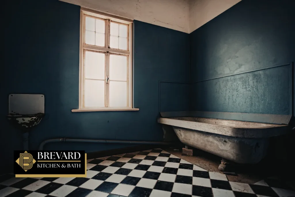 Older bathroom with a window and clawfoot tub