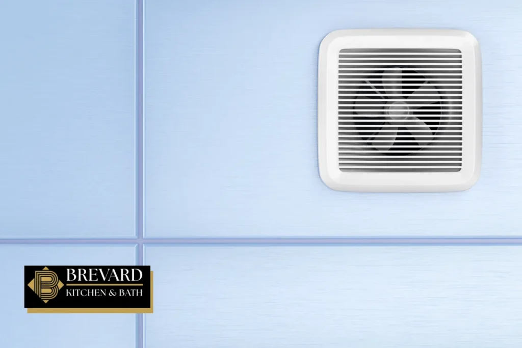 Square bathroom exhaust fan on a light blue wall