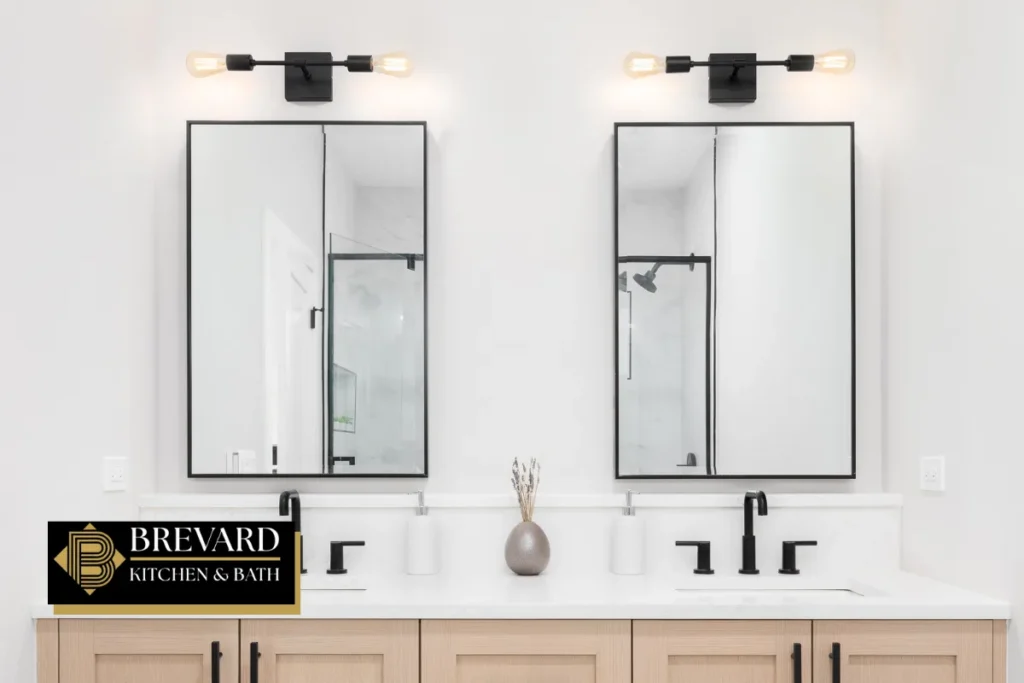 Double vanity with two black-framed mirrors and wood cabinets