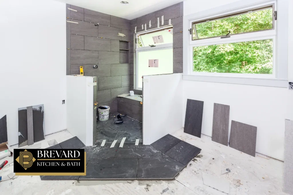 Bathroom floor prepared with waterproofing during a shower remodel